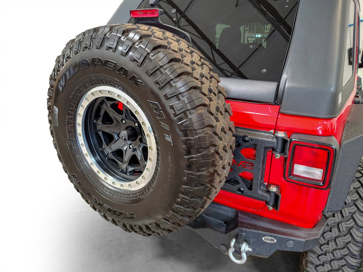 DV8 Offroad 2018+ Jeep Wrangler Tire Carrier - Premium Chase Racks from DV8 Offroad - Just 2321.86 SR! Shop now at Motors