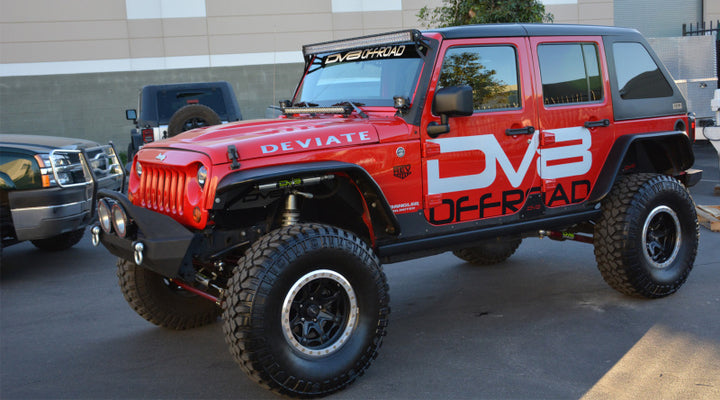 DV8 Offroad 07-18 Jeep Wrangler JK Over Windshield 50in Light Bar Mount - Black Steel - Premium Light Mounts from DV8 Offroad - Just 719.48 SR! Shop now at Motors